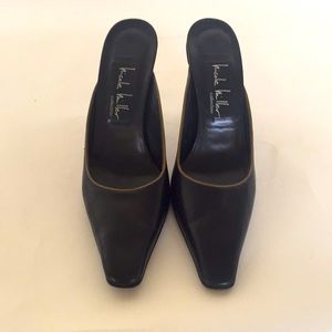 Nicole Miller black leather mules w taupe piping.